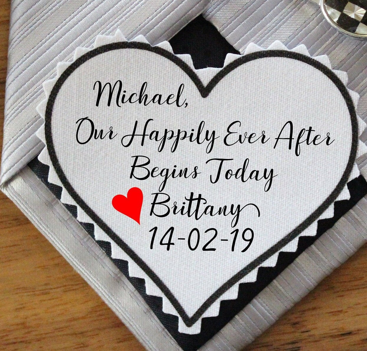 a heart tie patch with custom message from a bride to her groom