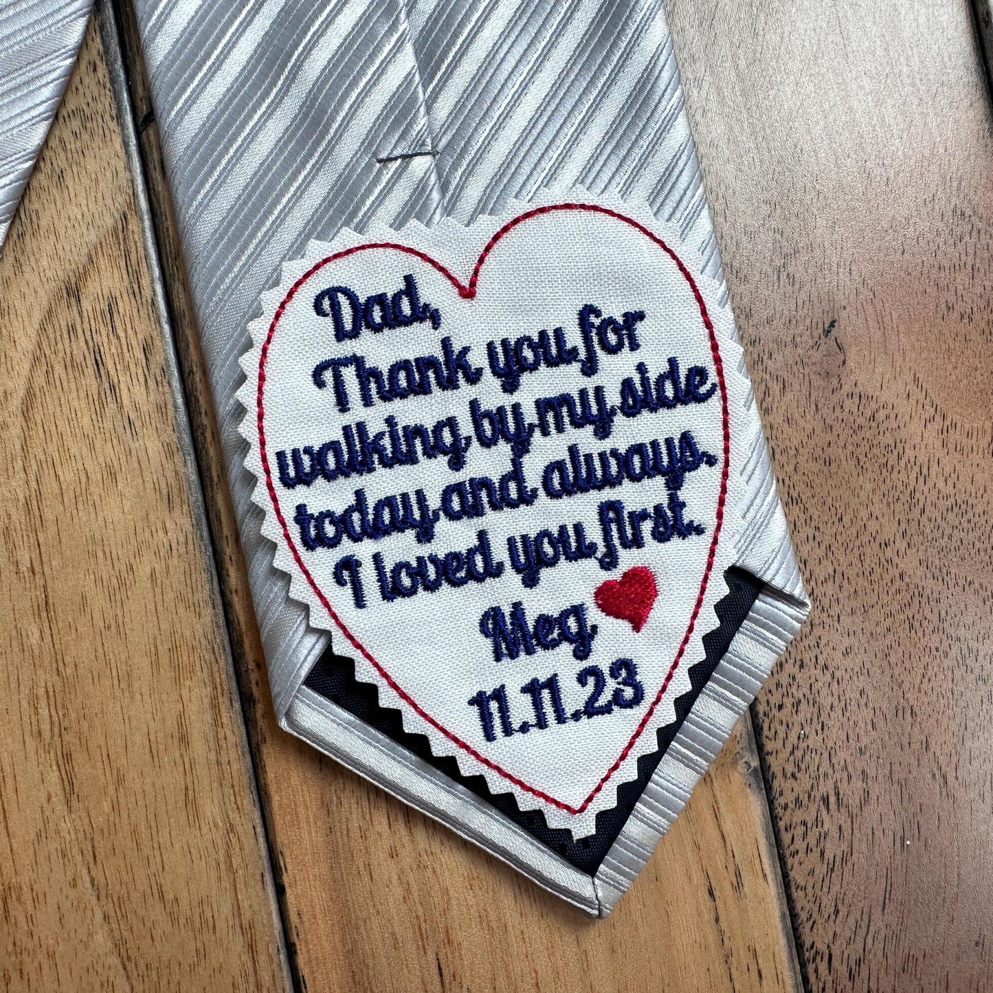 Personalized tie patch for the father of the bride, featuring an embroidered message from the bride to her dad on her wedding day. This heartfelt keepsake adds sentimental touch to the wedding attire