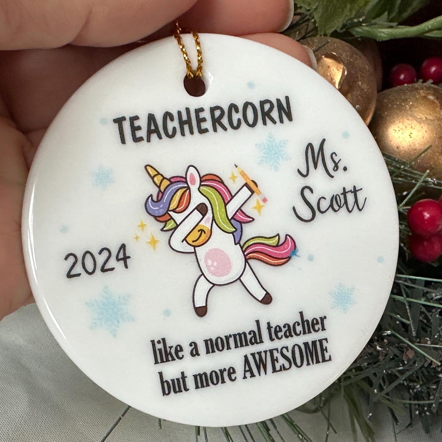 Round teacher ornament featuring a colorful, dabbing unicorn with the message 'Teachercorn, just a regular teacher but more awesome.' Personalizable with the teacher's name, this playful design is perfect for celebrating the extraordinary educator